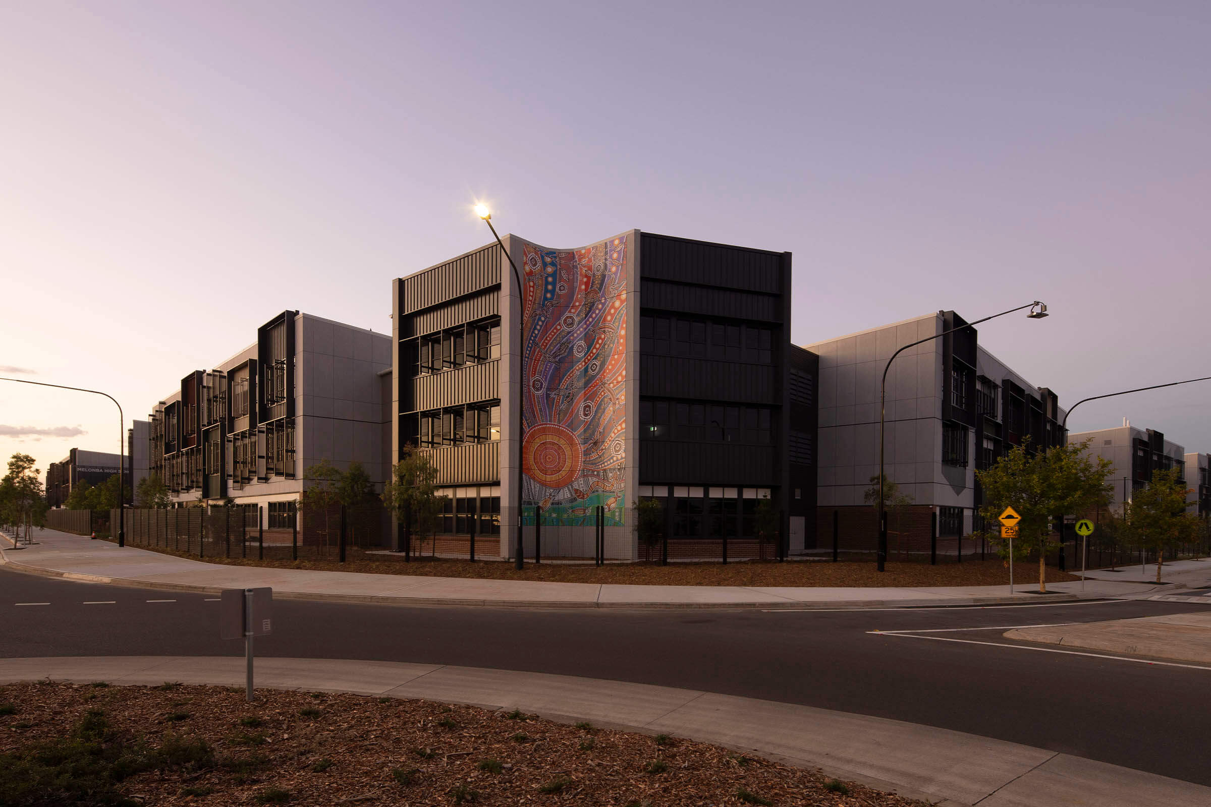 001-Indigenous-artwork-wraps-building-at-dusk-Melonba-Education-Campus-Richard-Crookes-Constructions-Public-Education