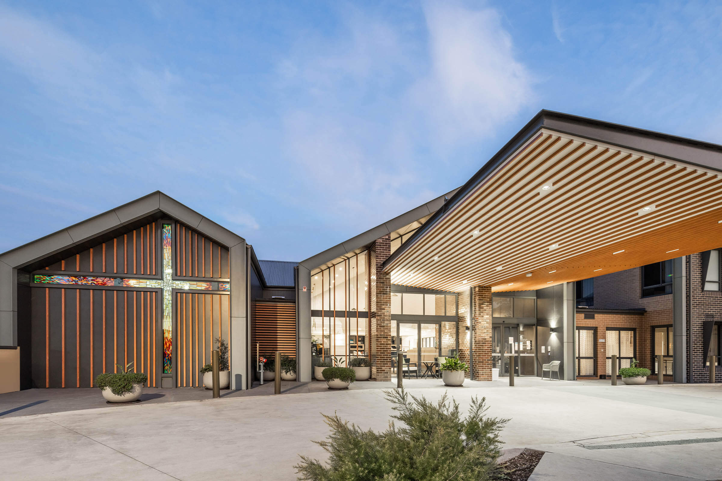 001-hero-image-multi-level-entrance-church-stained-glass-welcome-Mackillop-House-Norwest-Richard-Crookes-Constructions-Lifestyle-Living