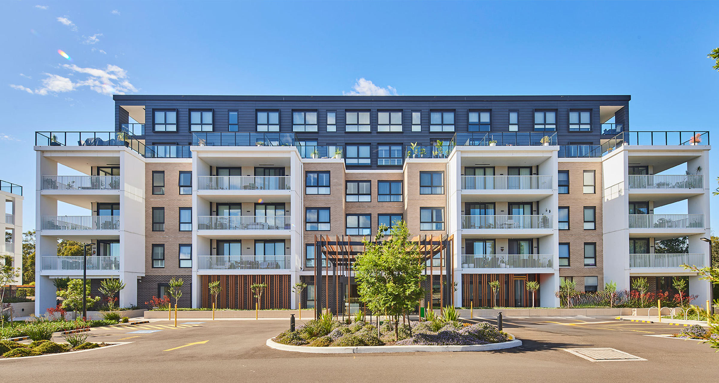 001-hero-banner-image-sunlit-building-a-street-view-richard-crookes-constructions-retirement-living-2025